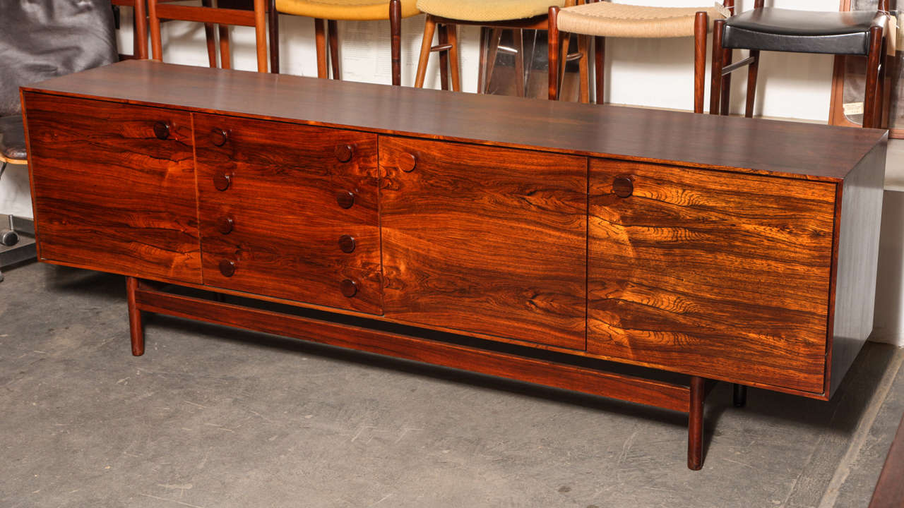 Vintage 1960s Rosewood Credenza by Ib Kofod Larsen.

This Vintage Cabinet is so beautiful that there would hardly be a photograph that gives it the justice it deserves. Great for the living room for all media (I can also drill holes in the back