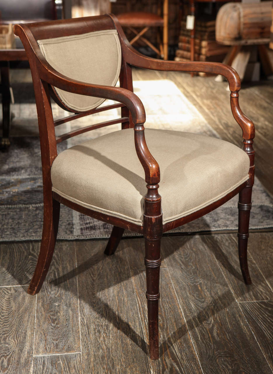 19th century English Regency upholstered mahogany chair.