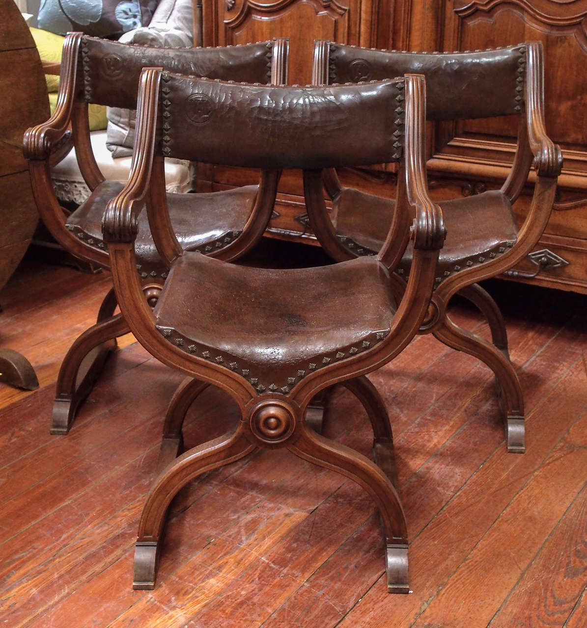 Set of six walnut and studded leather dining room chairs, late 19th century.