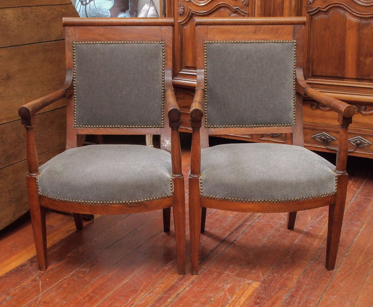 19th century pair of walnut armchairs newly reupholstered with gray mohair fabric.