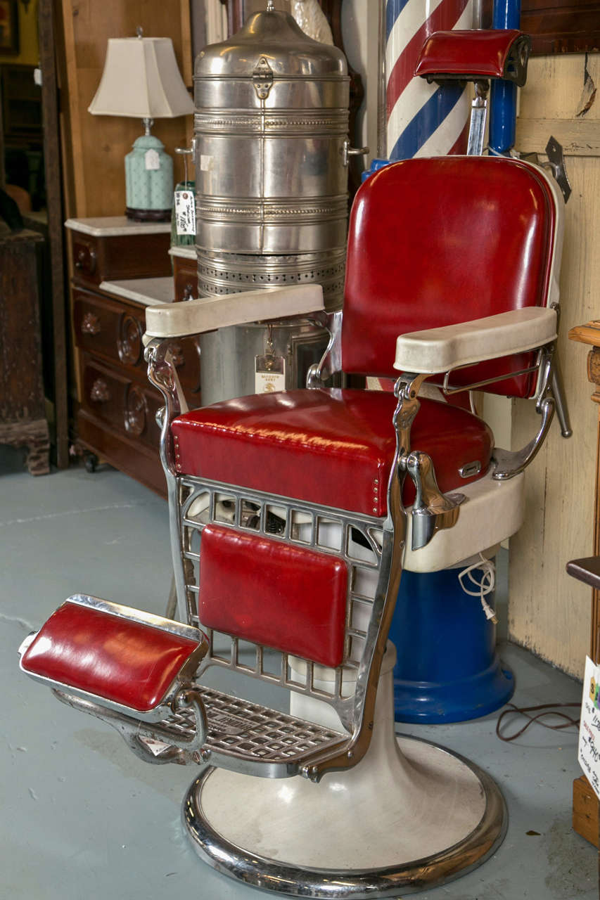 All original Barber chair from the early 1900's.  Porcelain with all original red leather seating.  The hydraulic pump is working. Year 1900 is when the Emil J. Paidar barber chair appeared.  It was manufactured in Chicago.  This chair is all