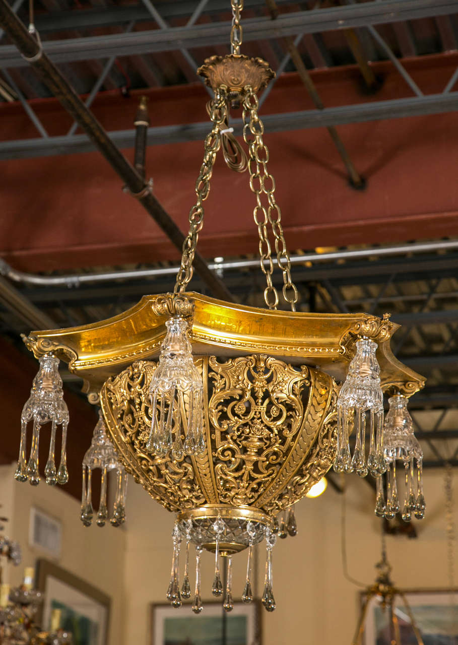 Truly gorgeous antique art deco bronze chandelier with 6 arms filled with bubble tear drop bohemian glass icicles.  All original antique european piece. This piece floats light in the air and is stunningly beautiful when lit.  The quality of