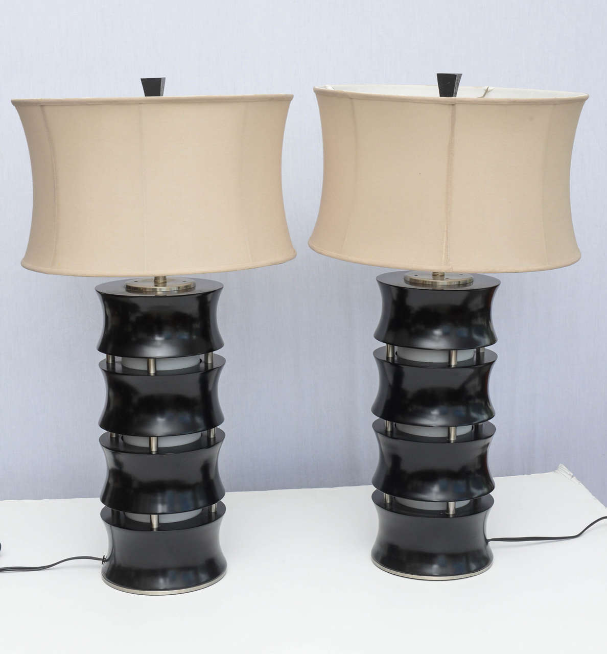 Wonderful pair of wooden lamps with interior lighting as well as traditional top lighting.  Casts a gorgeous ambient light from inside or a traditional light from the top.  1959 USA