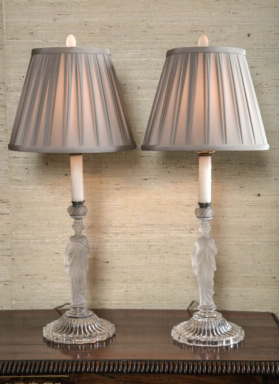 A fabulous near pair of sandwich glass Madonna stem lamps with exceptional detail. Newly rewired.