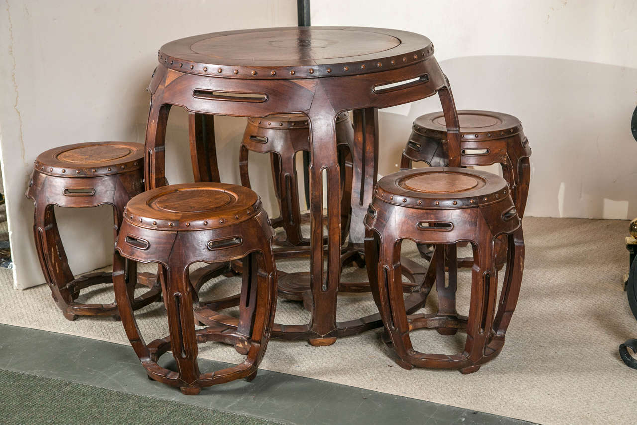 A Chinese rosewood and burl inset table with five matching stools - great for tea or a game of poker!  Each seat is 19 inches tall.