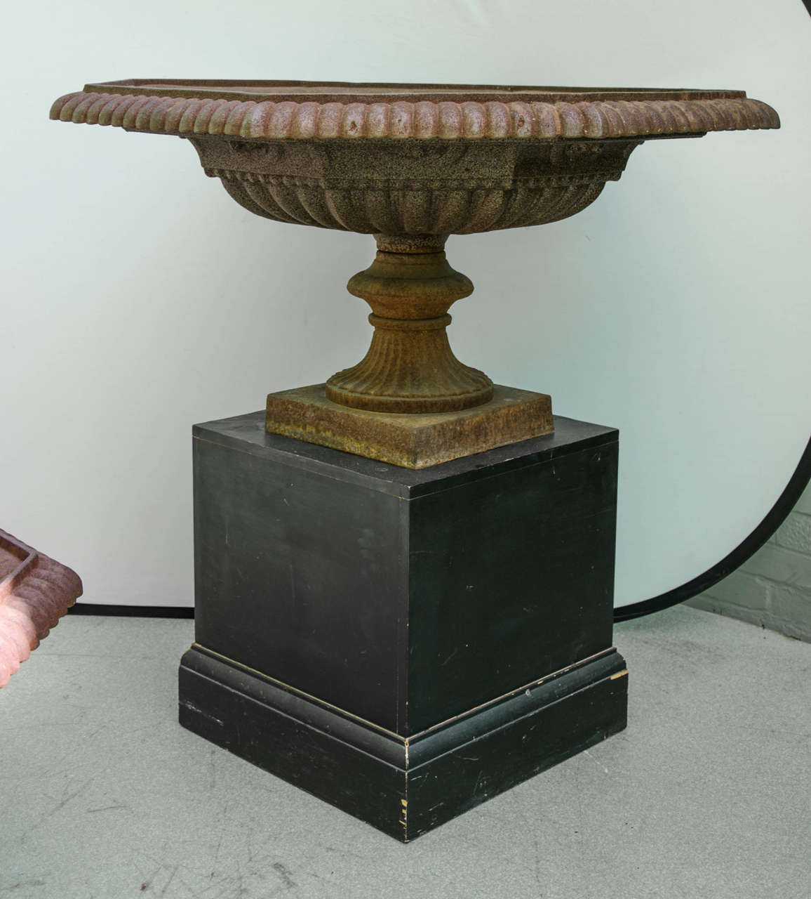 This pair of massively sized garden urns were created from cast iron and date circa 1910. The urns measure 44 in – 112 cm in diameter and a height of 22 in – 56 cm. The bases that the urns are resting on are not included in the sale and are not