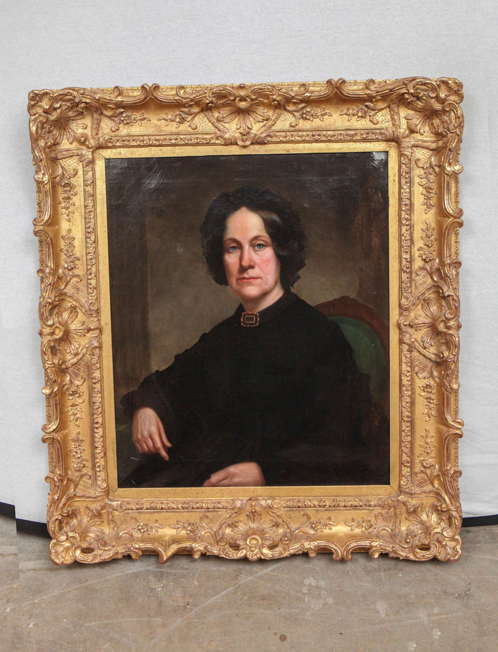 American or English early 19th century portrait of a lady, oil painting. The original carved giltwood and gesso frame has been gilded in 22-karat gold leaf.