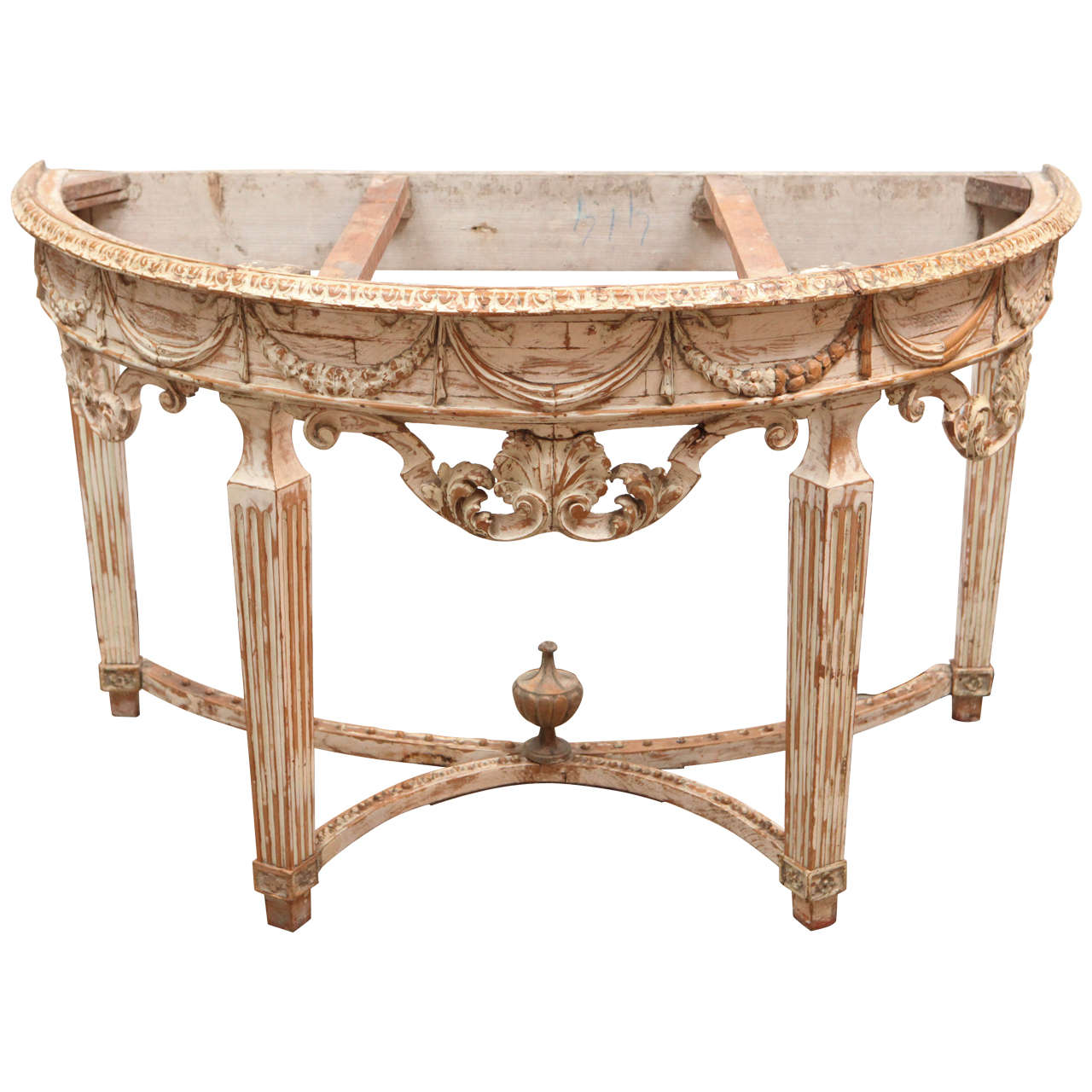 Early 19th century Italian carved demilune console table with stretcher and finely carved shell and garland motif. The siena marble top is original. It was originally gilded and now hardwood and gesso remains with a waxed finish.
