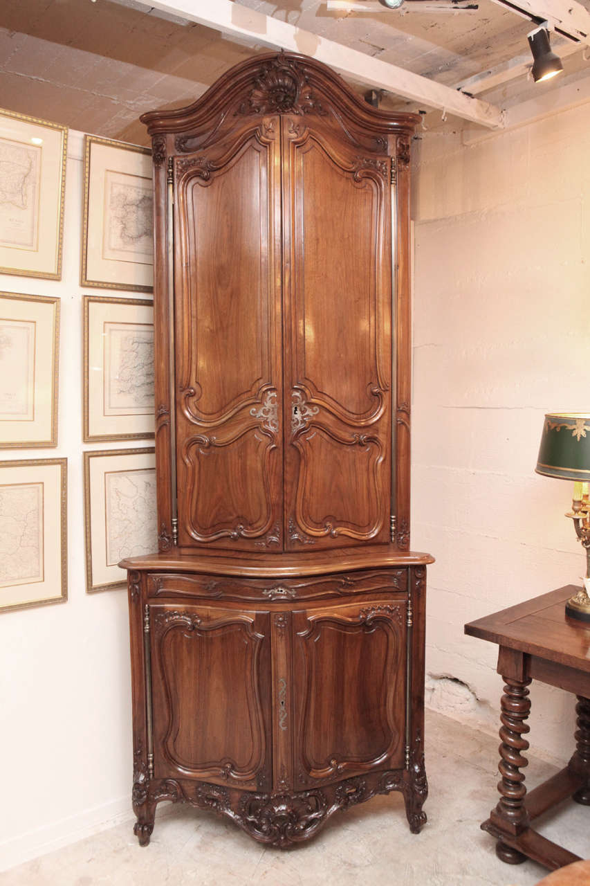 Very fine pair of late 19th century French walnut carved corner cabinets.
