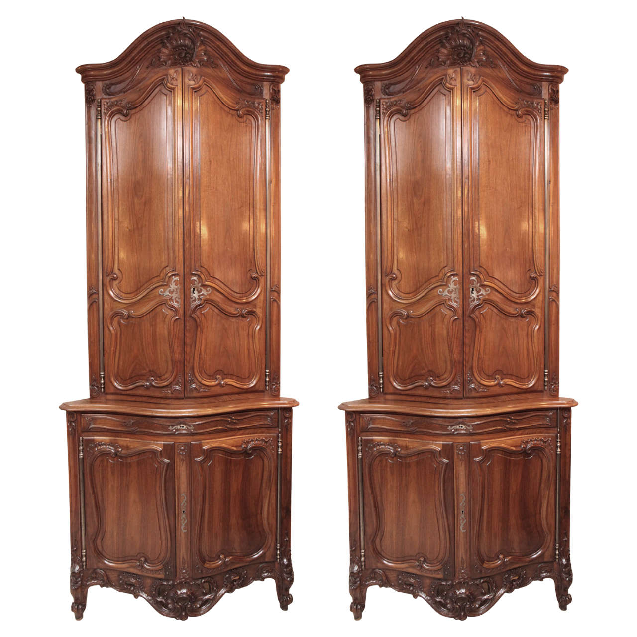 Pair of 19th Century French Walnut Carved Corner Cabinets