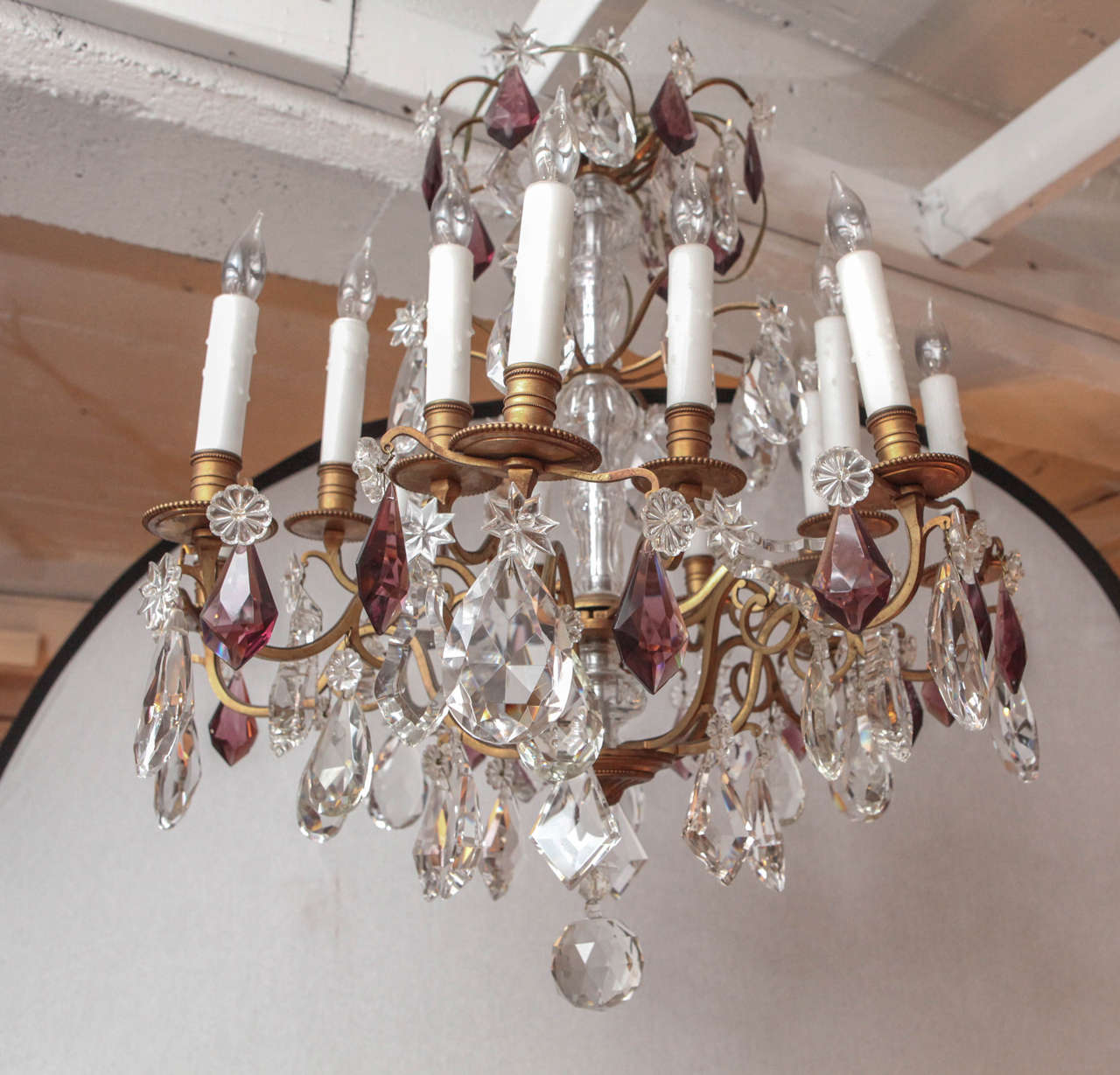 Late 19th century French doré bronze two-tiered chandelier with clear and amethyst crystals. The chandelier has sixteen lights and has been newly wired.