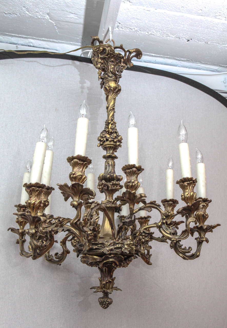Late 19th century French bronze chandelier with oak leaf motif. The chandelier has twelve lights and has been newly wired.