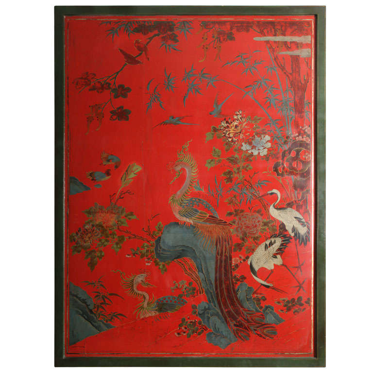 A mid-18th century red Chinese lacquer panel, decorated in vibrant colors with a pair of phoenixes and a pair of white cranes in a foliate and rock work landscape, now mounted as a coffee table on a custom-made base.