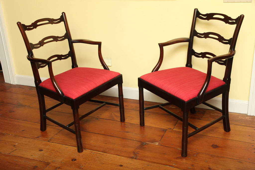 Very fine pair of Chinese Chippendale period ladderback open armchairs, having shaped and piercedsplats with outcurve stiles shaped arms and supports over a drop seat with show wood rails above 'bamboo
