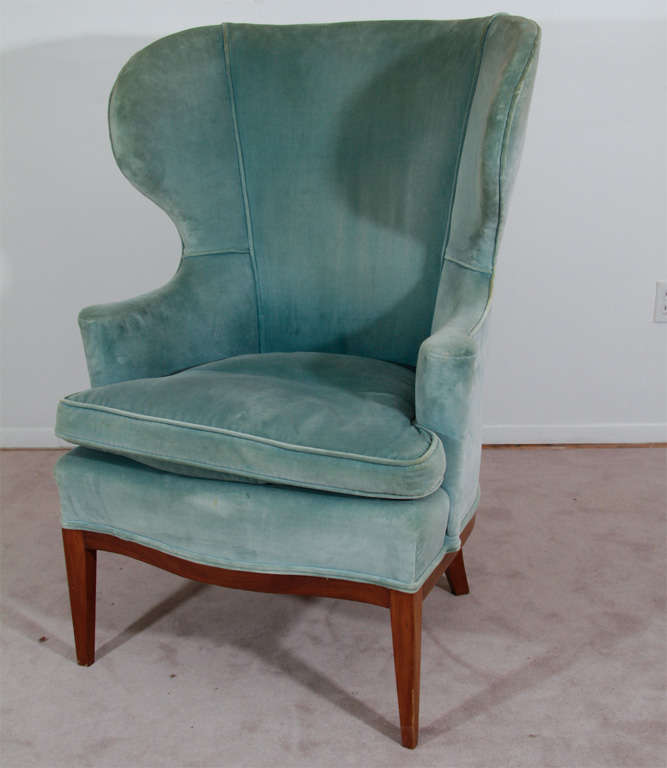 This magnificent wingback chair has been upholstered in a soft blue. This chair has simple and clean lines in a classic velvet with a mahogany frame. A very early Wormley design by Dunbar.<br />
<br />
Reduced From: $3,500