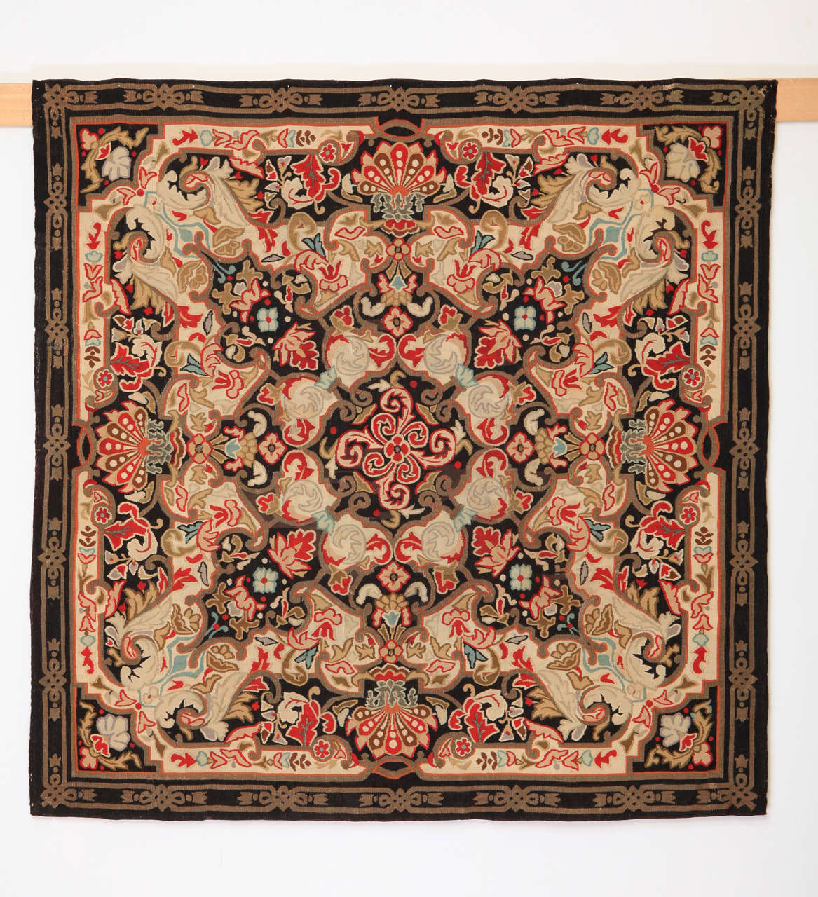 Aubusson rugs that were woven after the Restauration period distinguish themselves by a richer palette, as well as for employing architectural motifs often inspired by the ceiling decorations of the palaces from the Louis XIV-Louis XVI period.
This