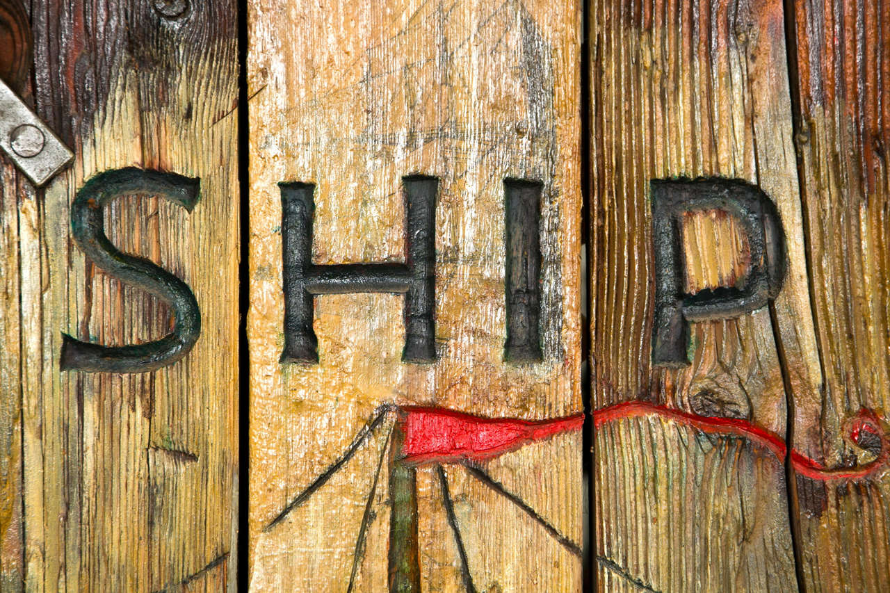 A museum quality, turn of the 20th Century ships hatch carved with a tall ship and 