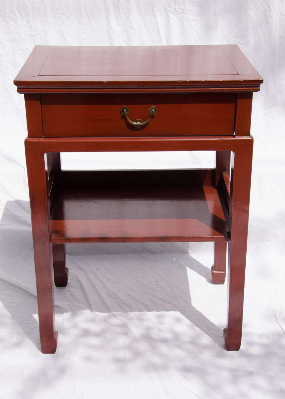 Turn of the century Qing dynasty Chinese lacquered side table with drawer and lower shelf.