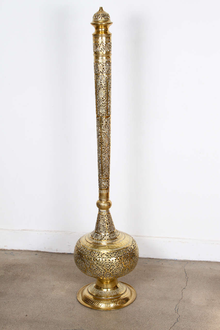 Elegant Tall Moroccan Polished Brass Incense Burner.
Intricately carved chiseled and hand-cut polished brass with removable lid. Onion- form with long neck on a circular base.
Could easily be rewired and converted to a floor lamp.

Mosaik