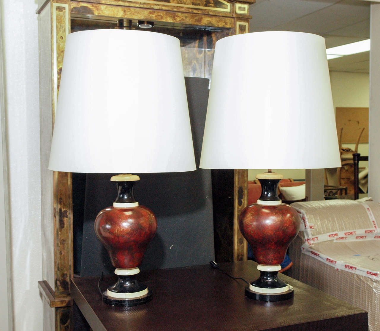 Two table lamps with exceptional decorative painting of faux marble and faux ivory; original shades.