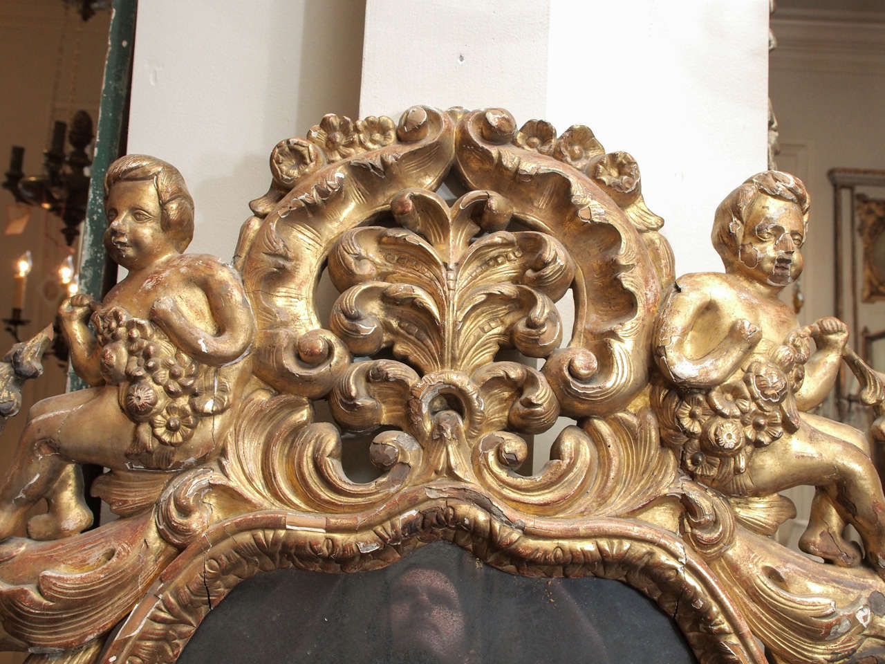 Rococo Pierced Giltwood Mirror with Putti and Sea Creatures For Sale