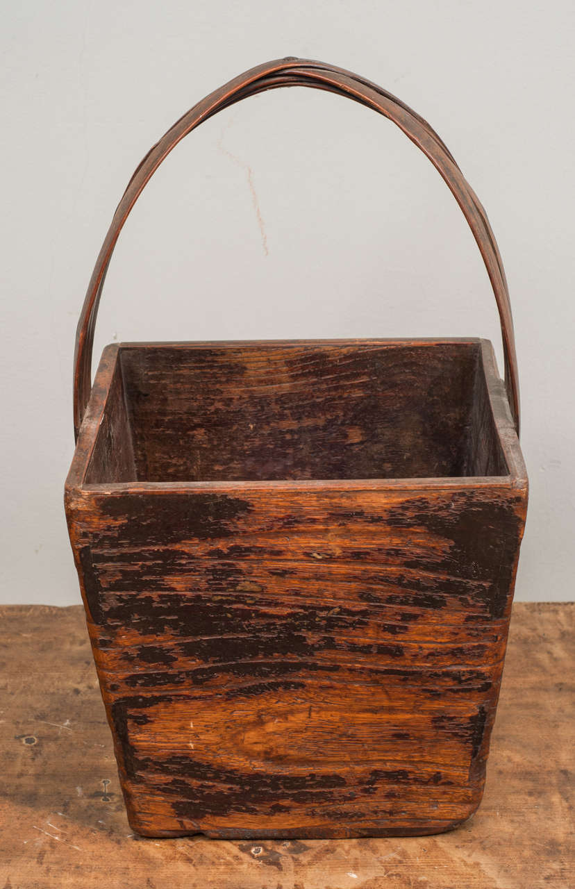Square wooden basket with handle.