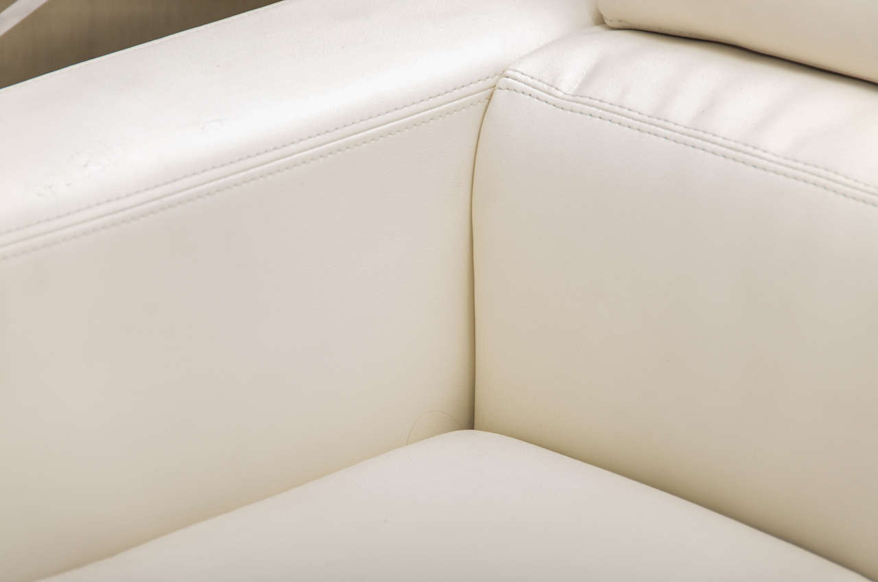 Pair of White Leather Swivel Arm Chairs in the style of Milo Baughman 1