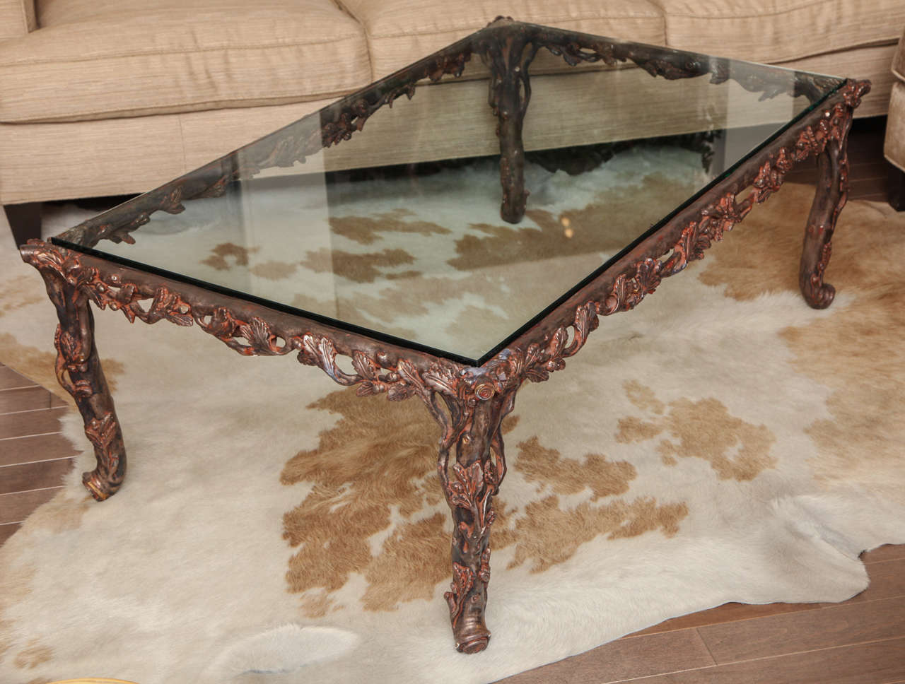 Large carved gilded faux bois cocktail table with glass top c. 1970