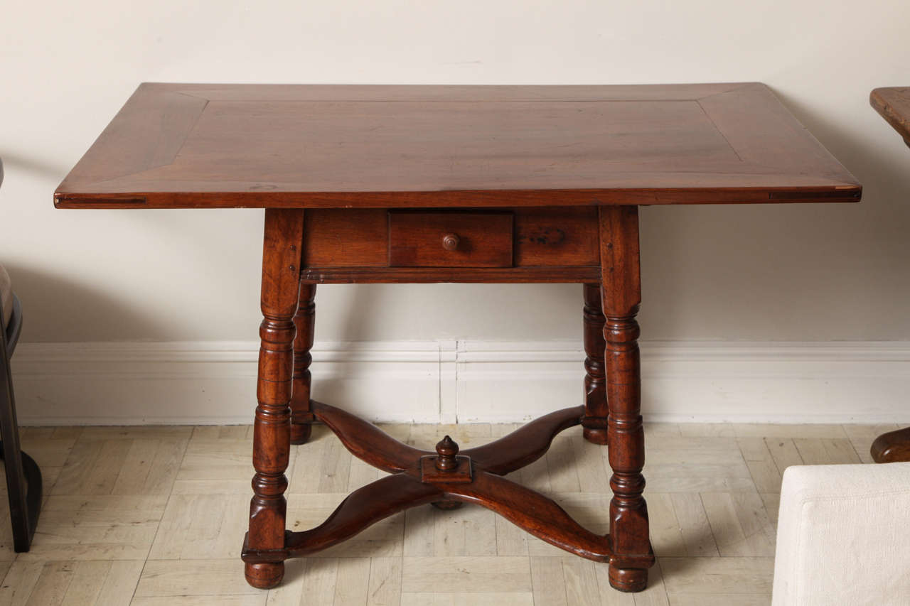 19th century mahogany centre table, one drawer in apron on turned legs joined by cross-stretchers, bun feet.