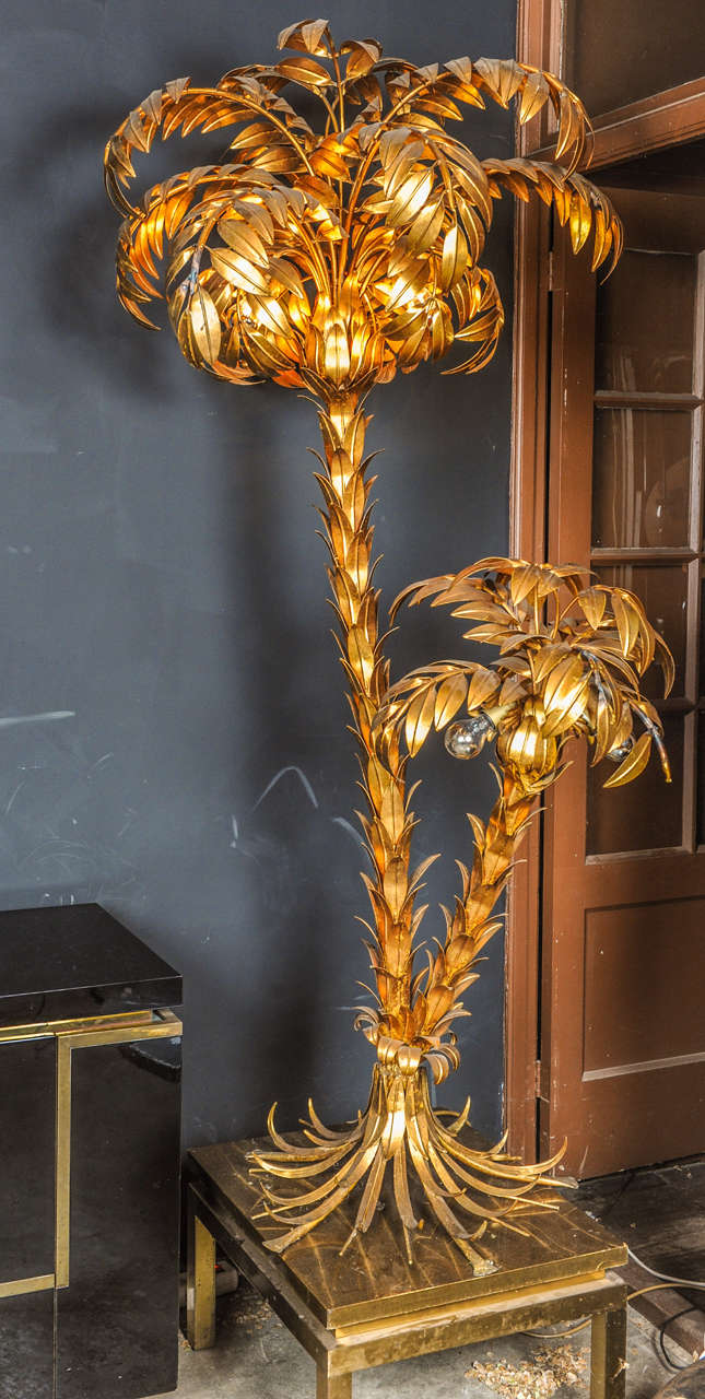 Exceptionally beautiful two-trunk palm tree light by German Baroque designer Hans Kogl (Koegl) This huge floor light has six-light sources hidden underneath the gilded leaves. This is an absolutely amazing eye catcher and centrepiece in any