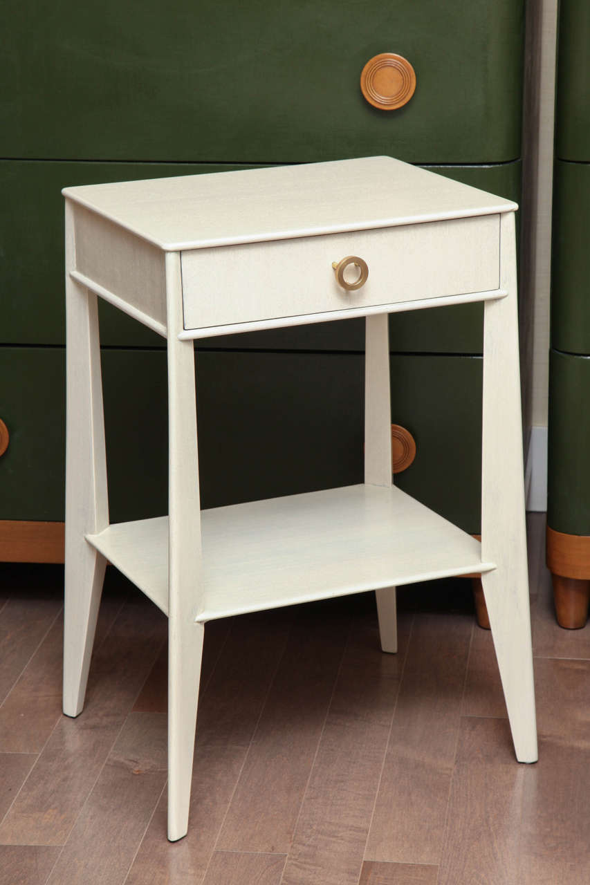 Pair of white washed bedside tables with original brass hardware, circa 1950.