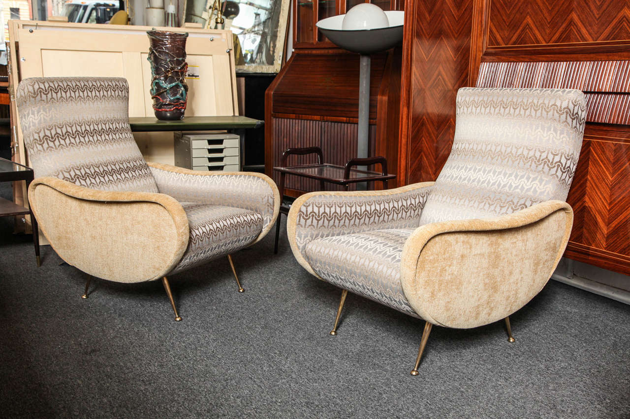 Stunning pair of armchairs made in Milan 1955, great form legs in brass, beautiful quality.
 