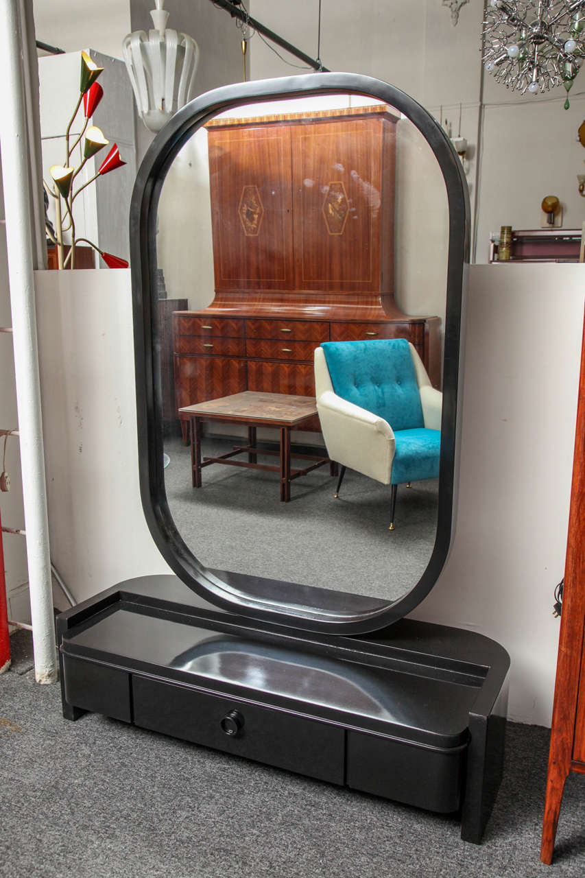 Fabulous dressing mirror made in Torino Italy by Vittorio Valabrega in 1930. The mirror swings from side to side with a large drawer below, unusual to find an art deco dressing mirror from this time probably a commission piece.
 