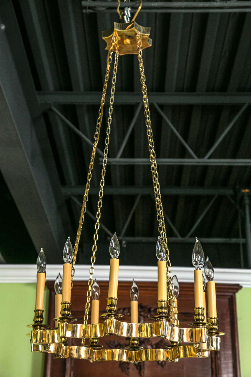 A 12 light mid-century brass chandelier, circa 1940's.