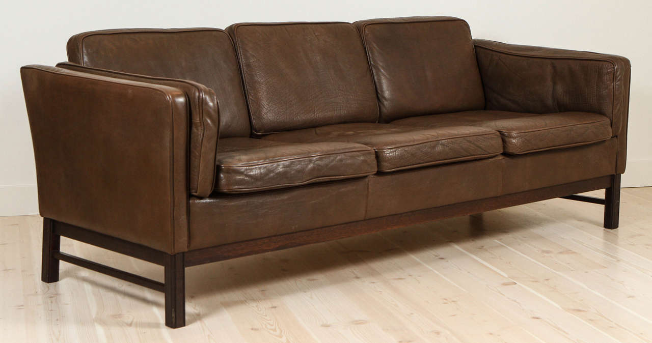 Leather sofa with rosewood base in the style of Børge Mogensen.