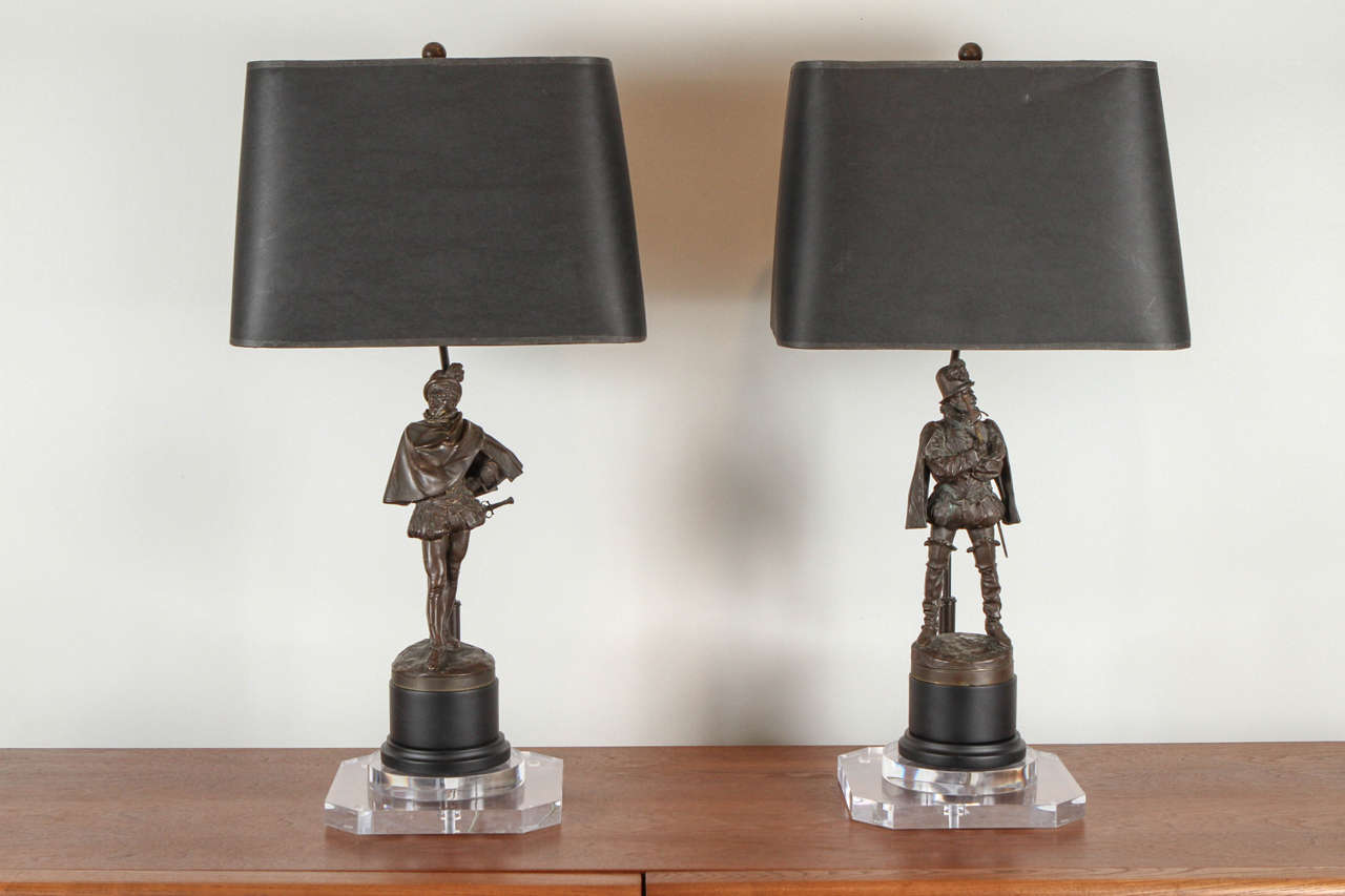 French bronze soldier lamps with lucite base.
French mount. Black paper shade. New wiring.
Soldiers are free standing and can be removed from bases and used as sculptures.
Sold separately.