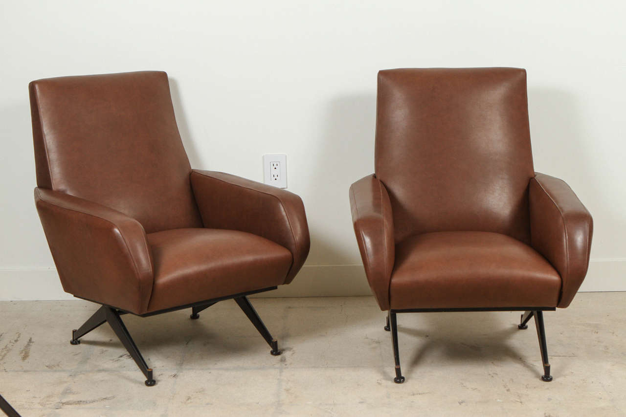 Pair of Italian leather chairs in the style of Arflex.
New leather upholstery. Professionally restored.
