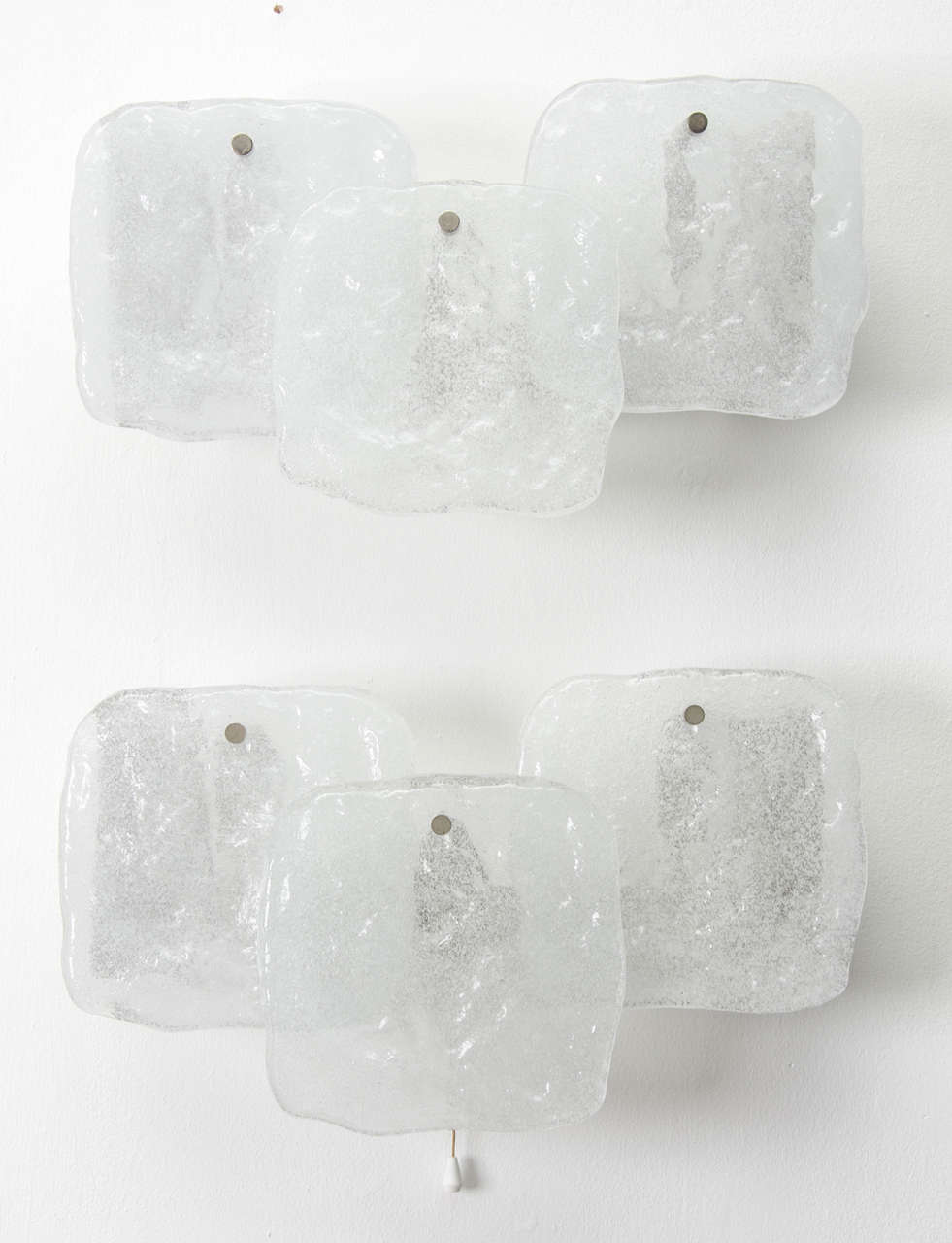 Pair of ice glass panel sconces by Kalmar of Austria. 

Each sconce has three glass panels which hang from metal wall-mounted chrome frames; they are in excellent original condition. Measures: Glass panels are approximately 17 cm x 17 cm.

Two
