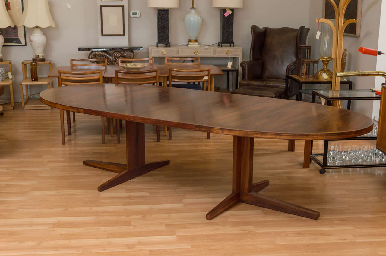 Beautiful oval rosewood dining table, designed by John Mortensen for Heltborg Mobelfabrik, Denmark.
Comes with two leaves that are 19.50 in wide x 48.25 in deep. Measurements below are without the leaves in.