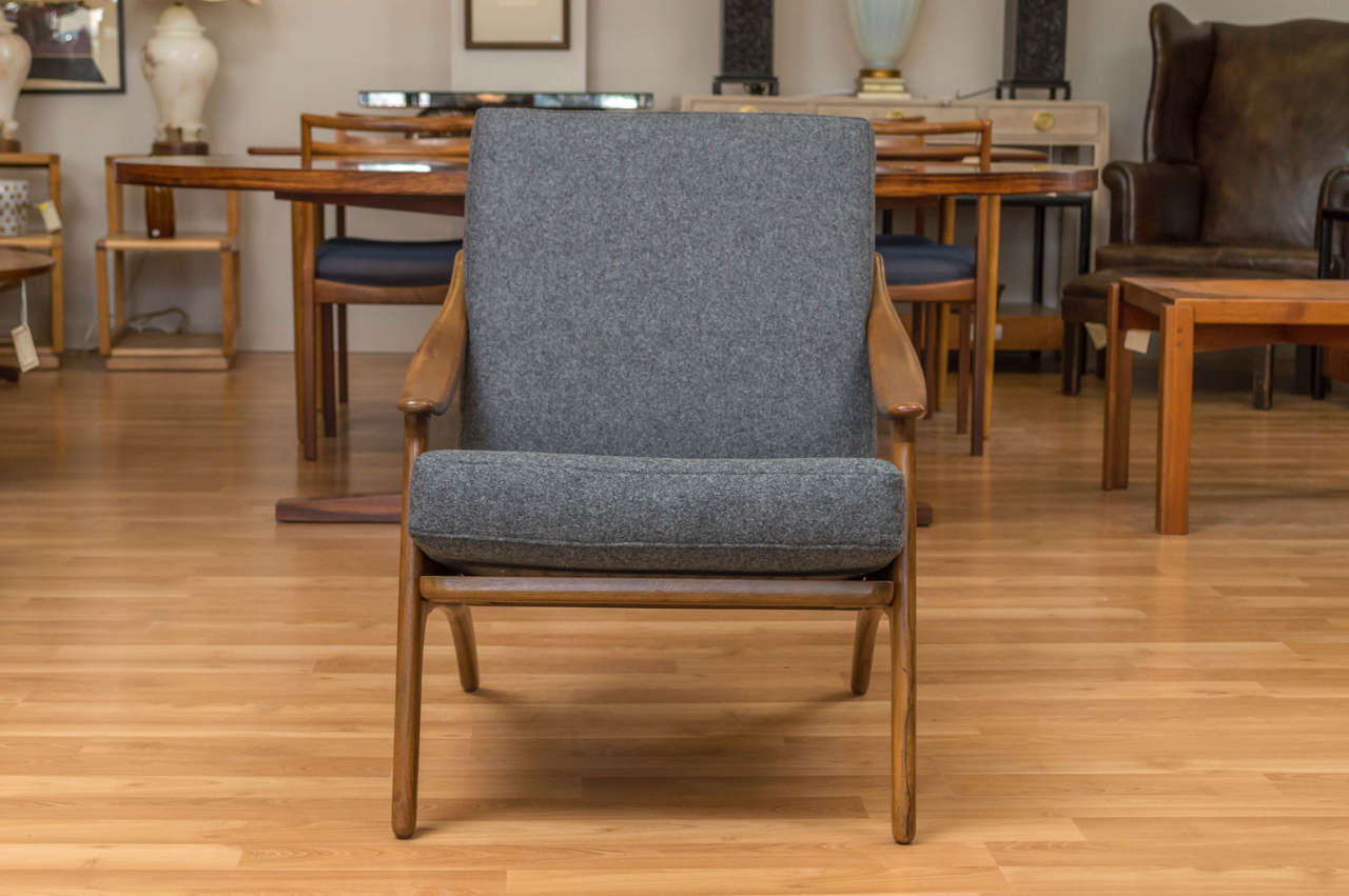 Easy lounge chair with style, by Arne Hovmand-Olsen, designed in 1957, and made by P. Mikkelsen.  Newly reupholstered in a Grey wool.