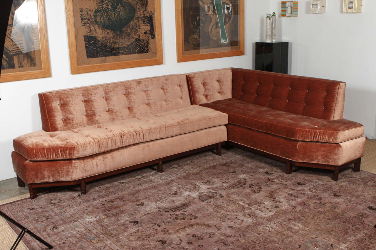 Rare sectional sofa by Frank Lloyd Wright. This piece was designed in the mid-1950s and produced only for a very limited time. This collection follows Wright's signature organic style which has overtones of the Arts and Crafts movement and features