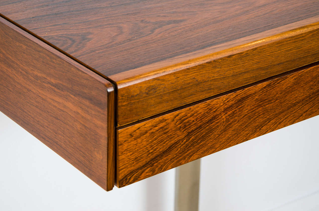 Minimal rosewood desk or console with four drawers and aluminum kangaroo legs. Designed for the planar collection by Robert Heritage for Archie Shine.