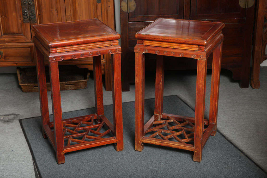 Chinese Pair of Late Qing Dynasty Elmwood Pedestal Tables with Openwork Stretcher