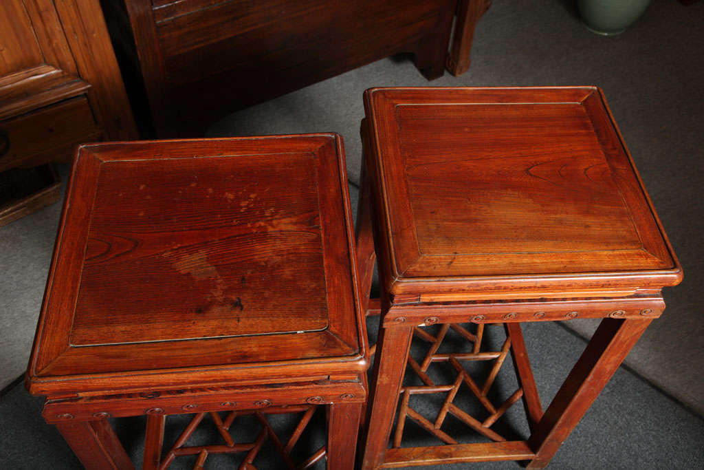 Pair of Late Qing Dynasty Elmwood Pedestal Tables with Openwork Stretcher 1