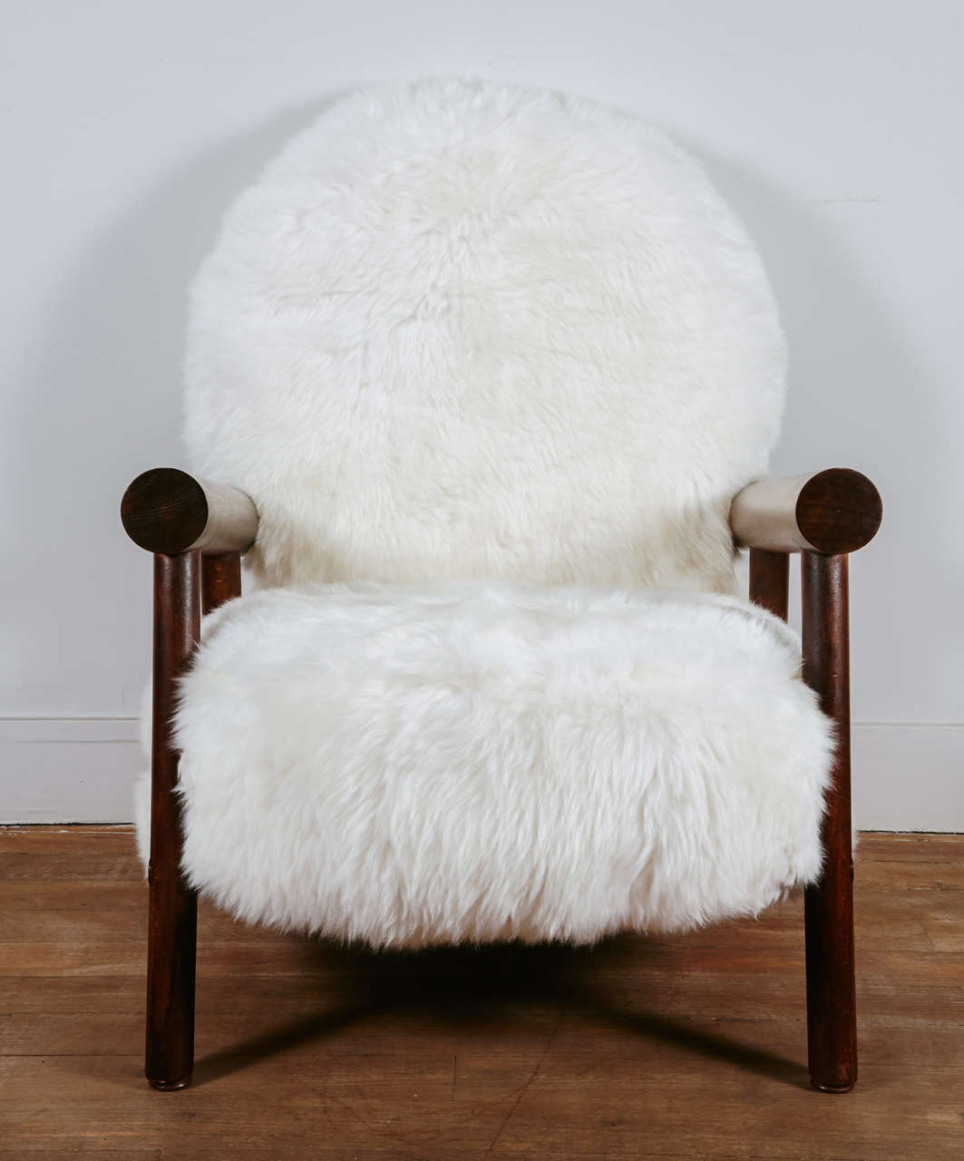 An interesting pair of mountain lounge chairs upholstered with sheep skins 
France, circa 1960