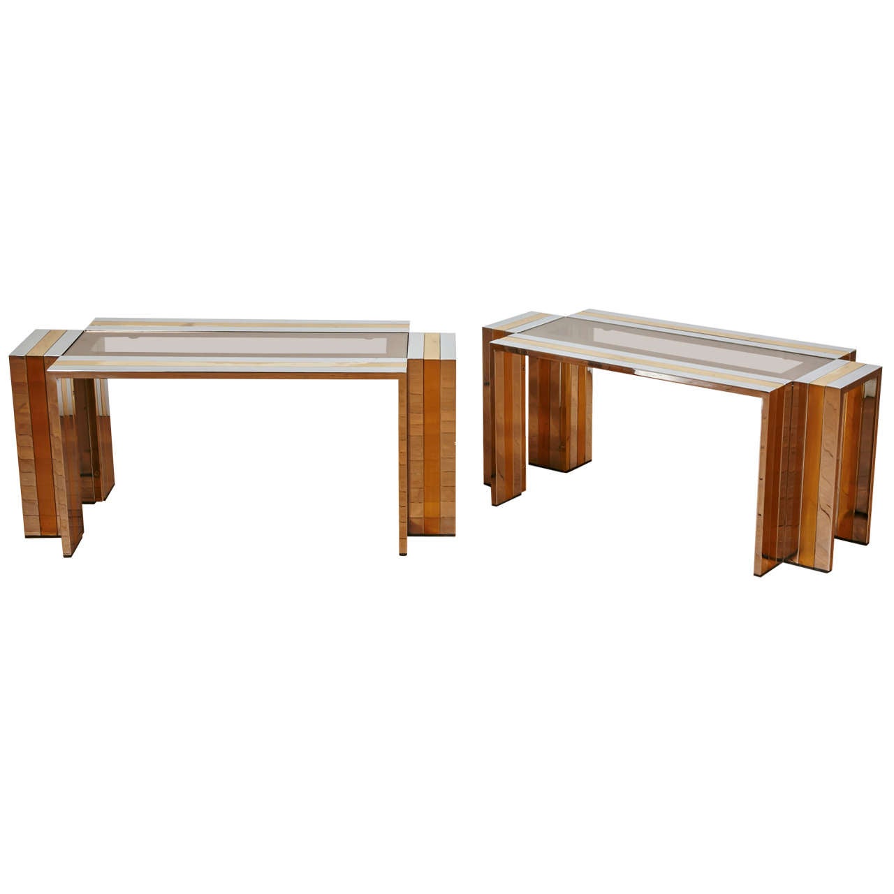 Pair of gilt brass and chromed steel coffee tables by Romeo REGA, 1970's.
Crossed rectangular shape, smoked glass top.