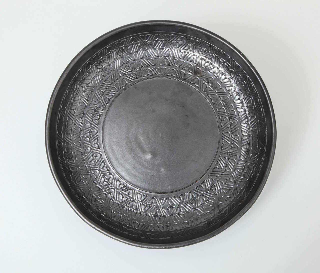 Incised ceramic bowl with platinum metallic finish. By Bitossi for Raymor.

