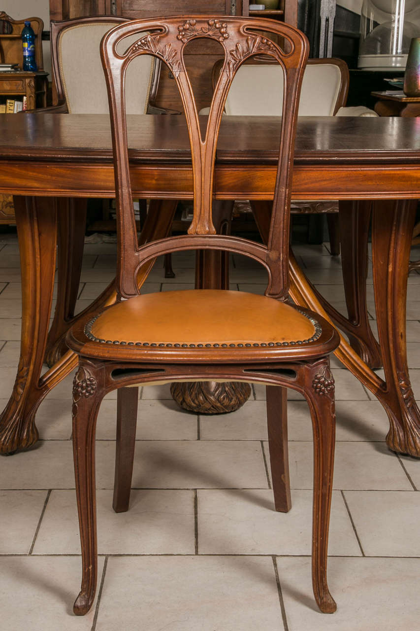 Carved Art Nouveau Mahogany Dining Table and 12 Chairs by Paul A. Dumas