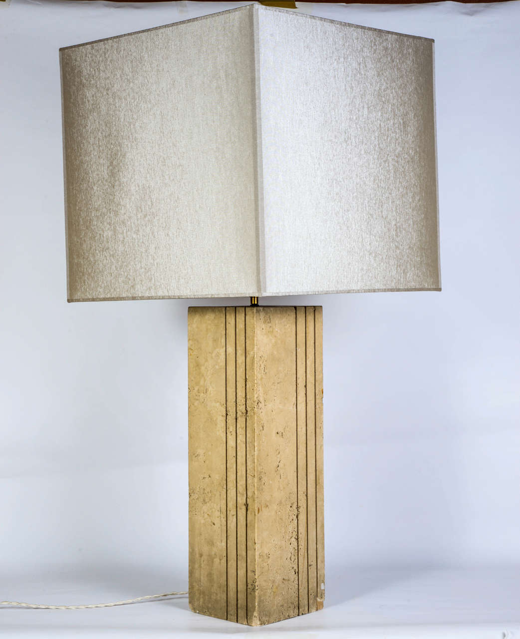 1930s stone table lamp with fluted right angles. New lamp shade in beige grey silk and new wiring. In the style of Marc Duplantier.

Lamp dimension:

- Height with lampshade 88cm
- Height without lampshade 48cm