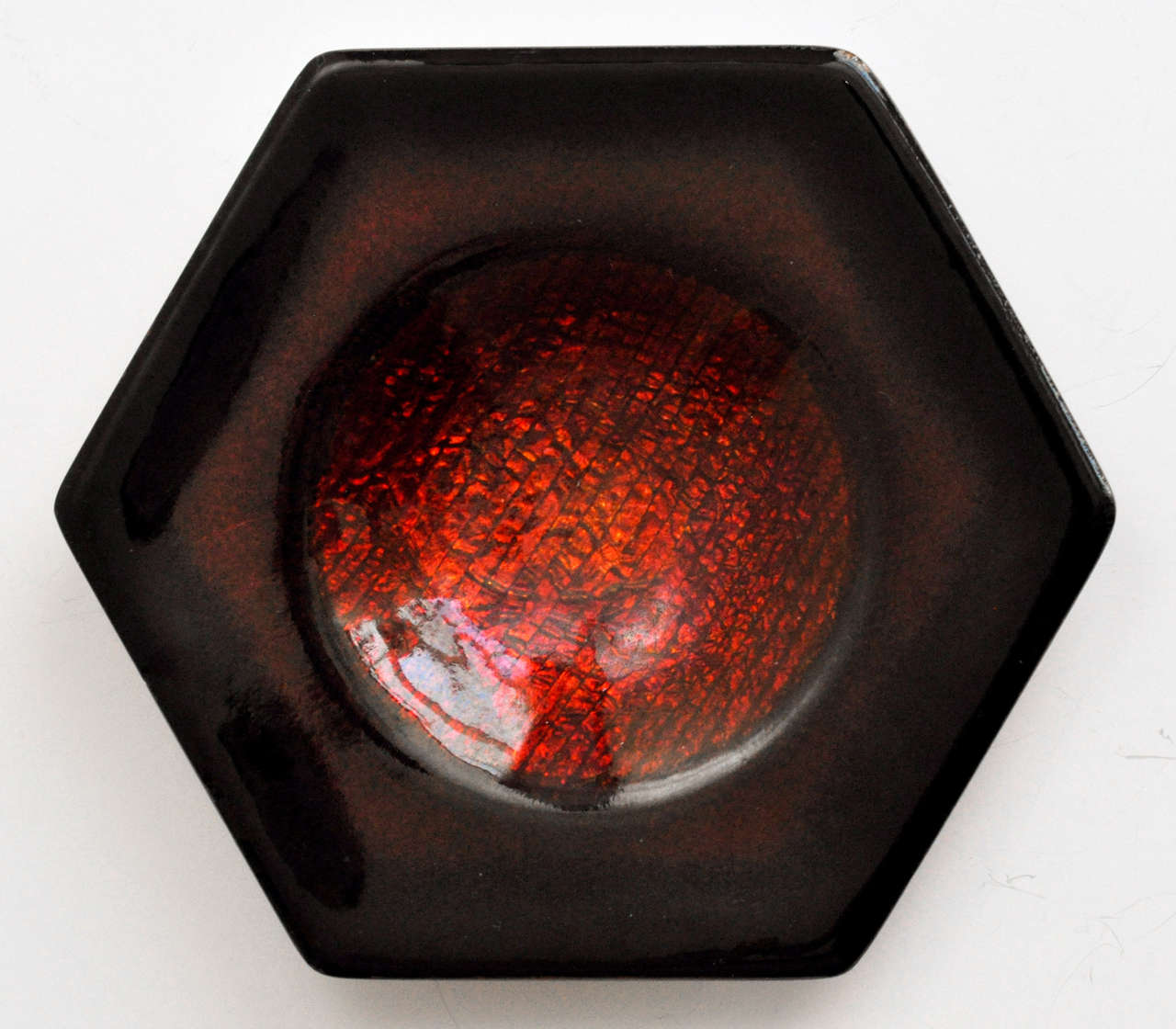 Deep scarlet red, hexagonal dish by Studio Del Campo. Rich color and interesting form signed (signature partially obscured).